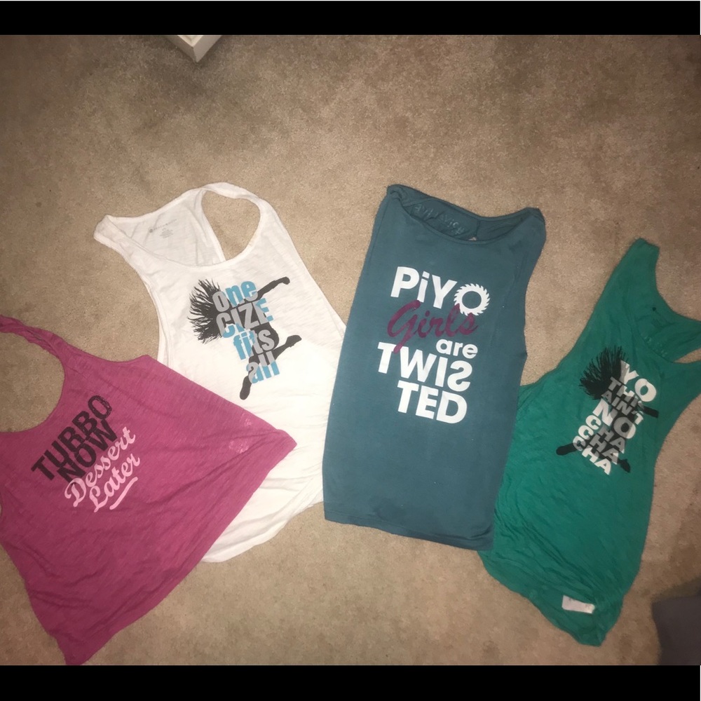 Bundle of Beachbody workout tanks.